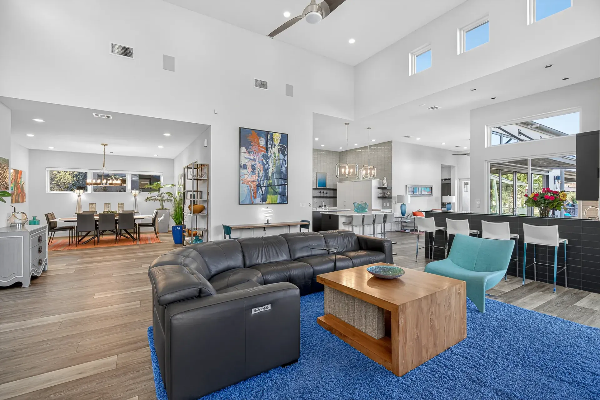 Open-concept living room looking toward kitchen and dining